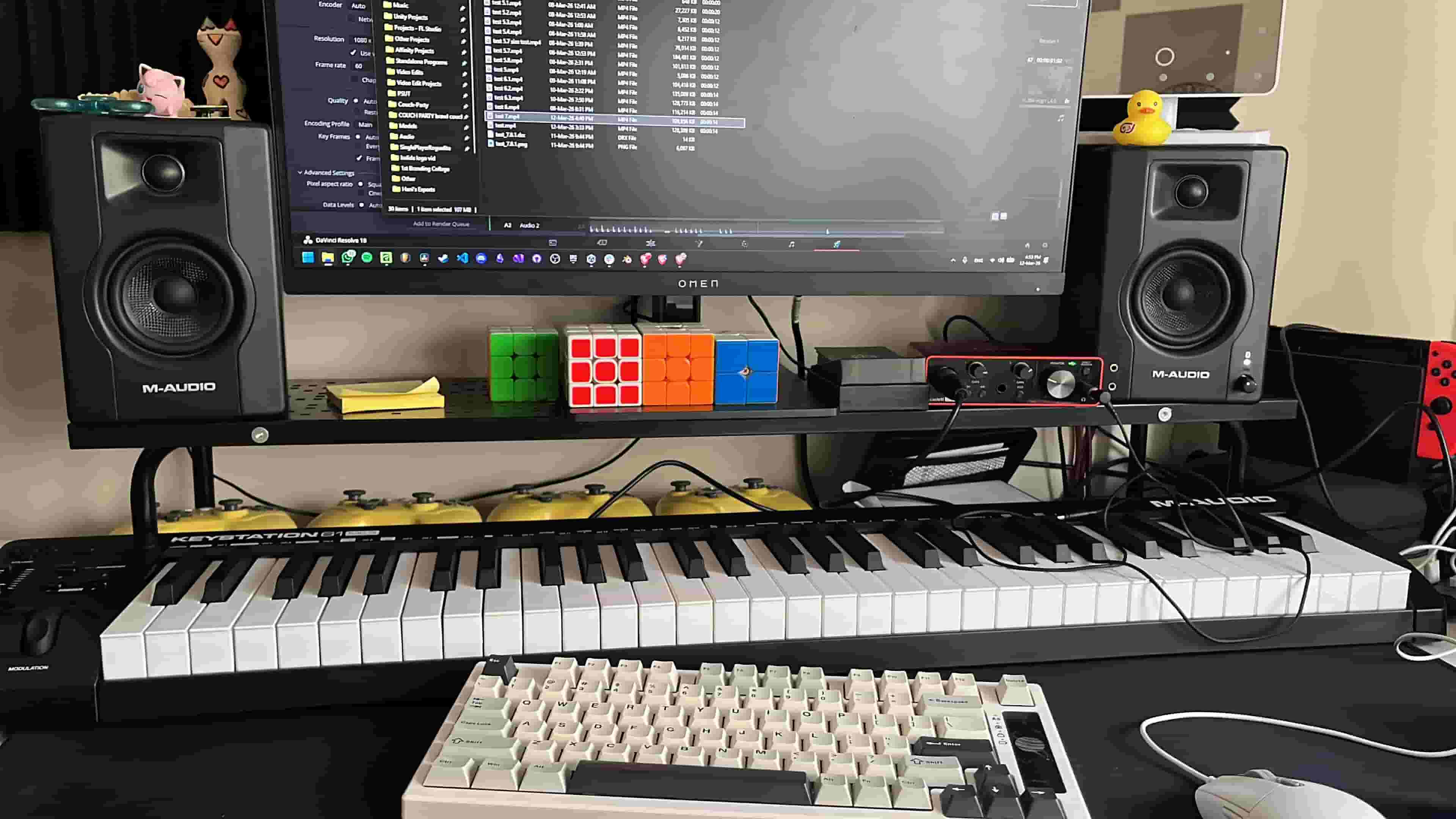 Studio desk with keyboard and monitors